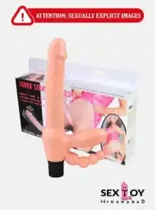 A Strapless Dildo Vibration item placed next to its charging cable on a wooden surface.